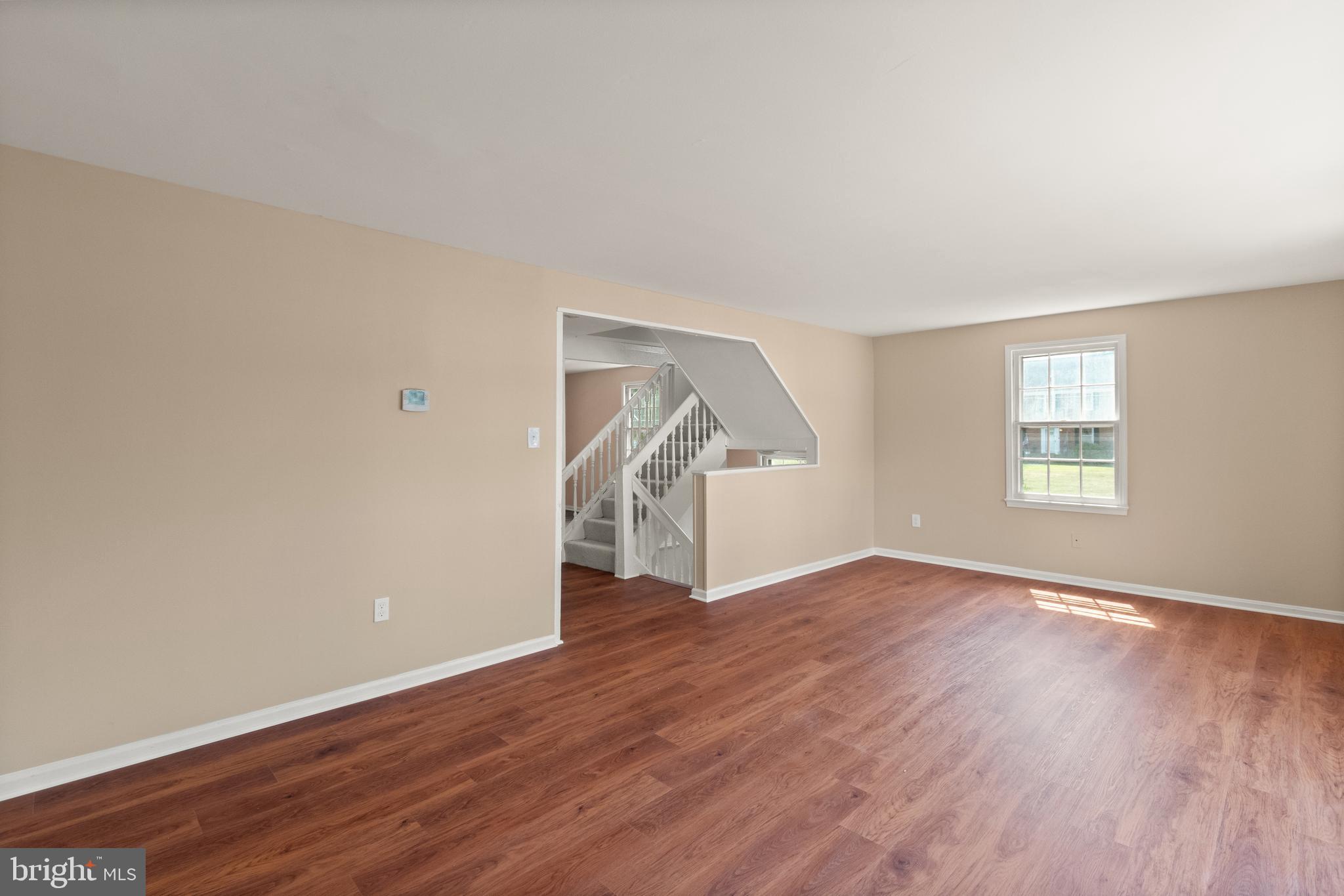 13143 Putnam Circle Woodbridge, VA 22191 - Photo 29 of 38 an empty room with wooden floor and windows
