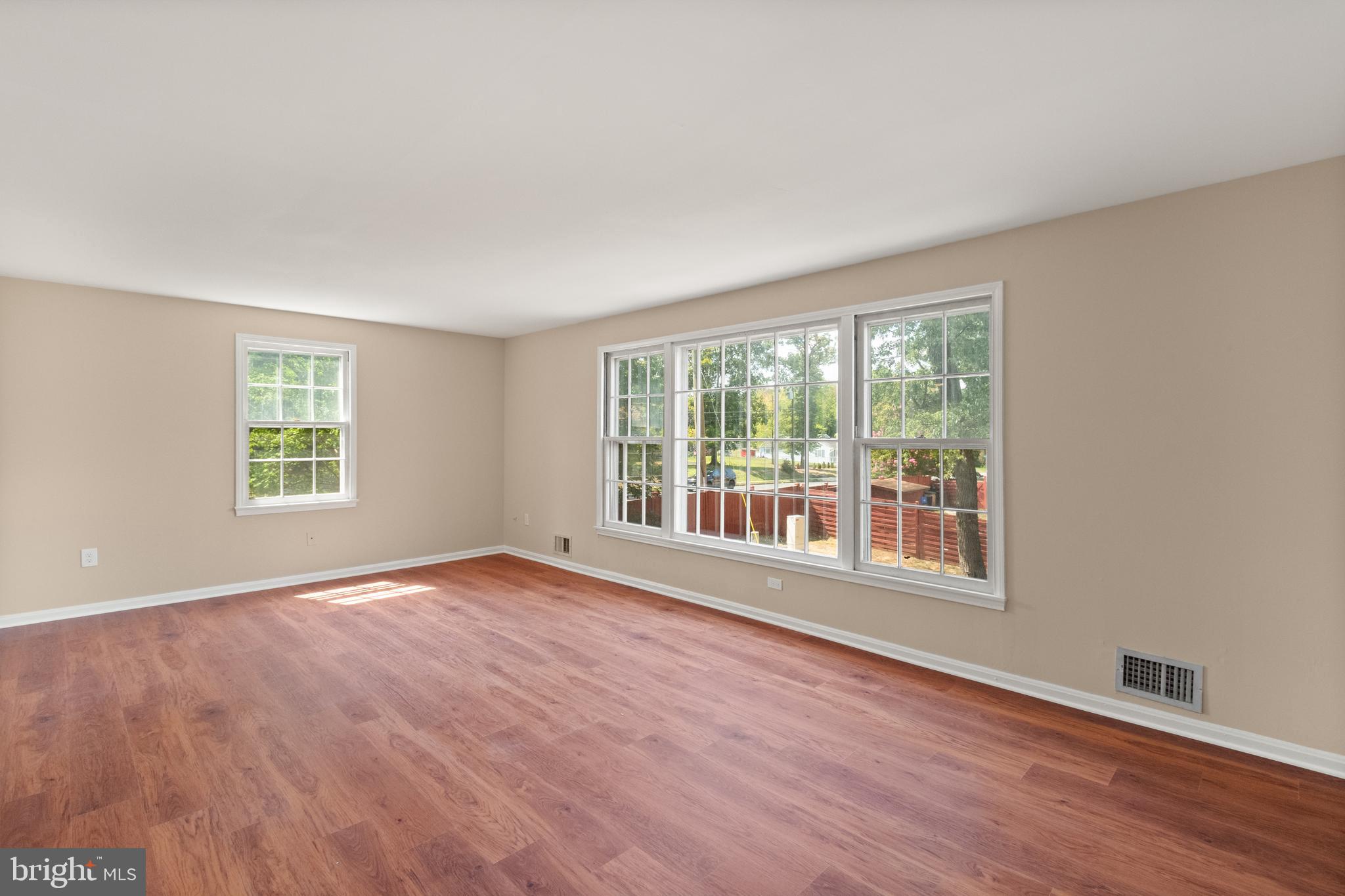 13143 Putnam Circle Woodbridge, VA 22191 - Photo 30 of 38 an empty room with wooden floor and windows