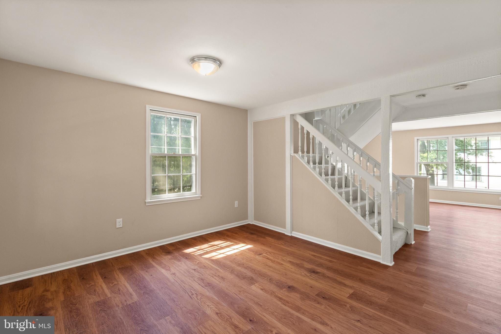 13143 Putnam Circle Woodbridge, VA 22191 - Photo 3 of 38 a view of an empty room with wooden floor and a window