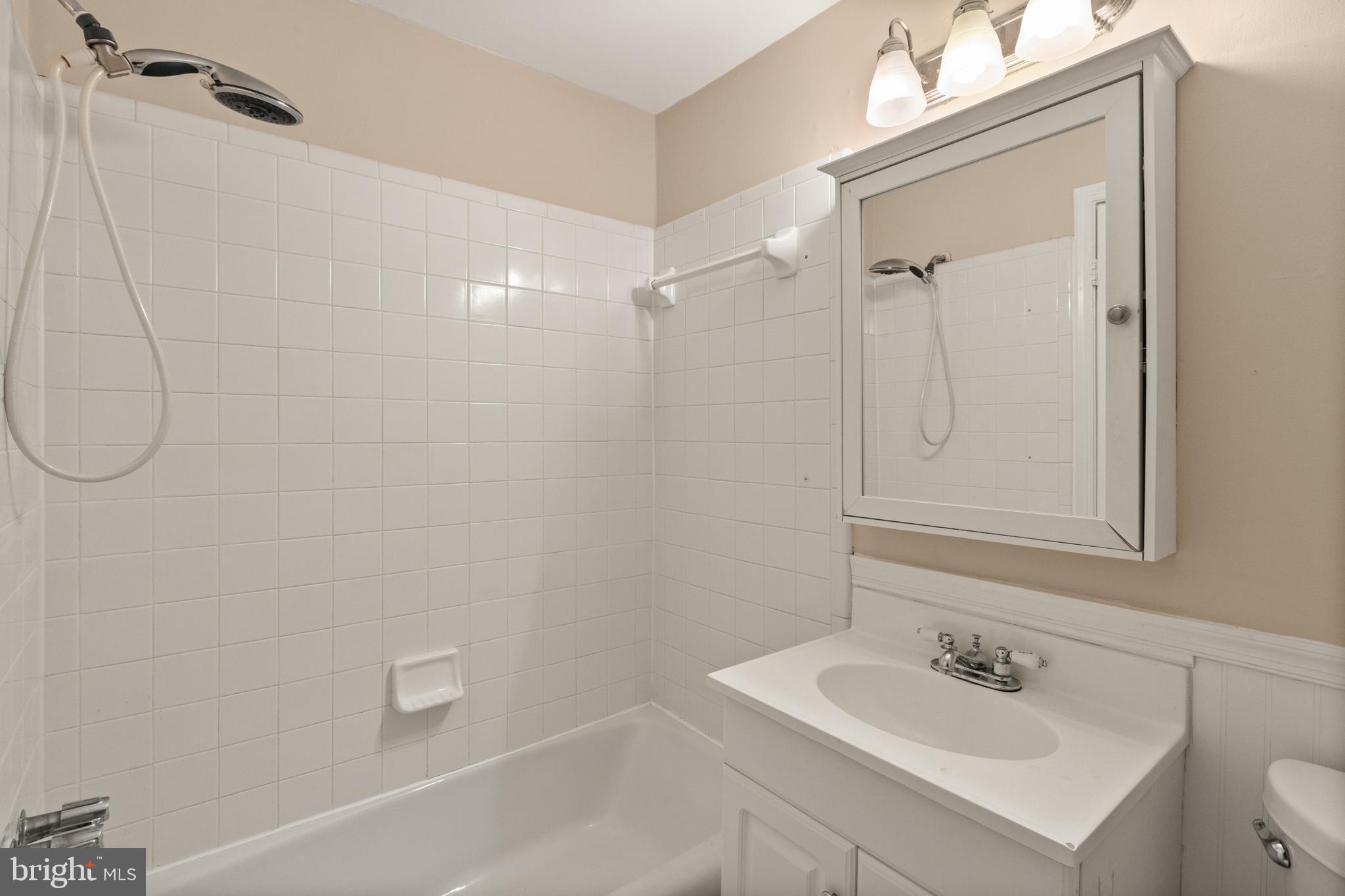 13143 Putnam Circle Woodbridge, VA 22191 - Photo 31 of 38 a bathroom with a sink a toilet and shower