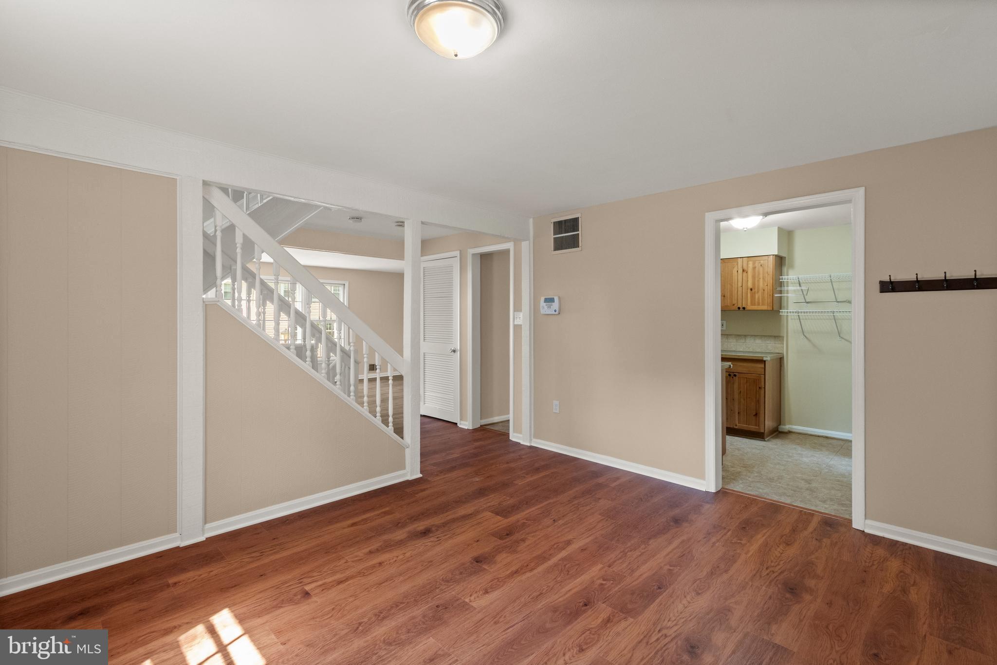13143 Putnam Circle Woodbridge, VA 22191 - Photo 4 of 38 a view of entryway with wooden floor