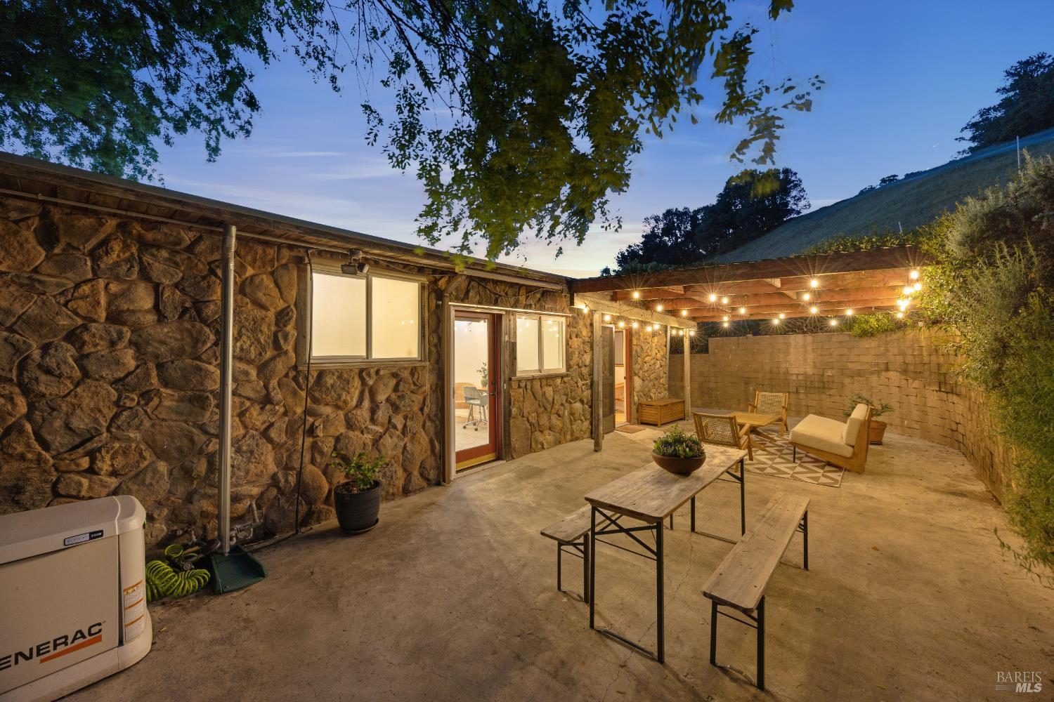 6960 Round Oak Road Penngrove, CA 94951 - Photo 41 of 58 a patio with yard glass top table and chairs