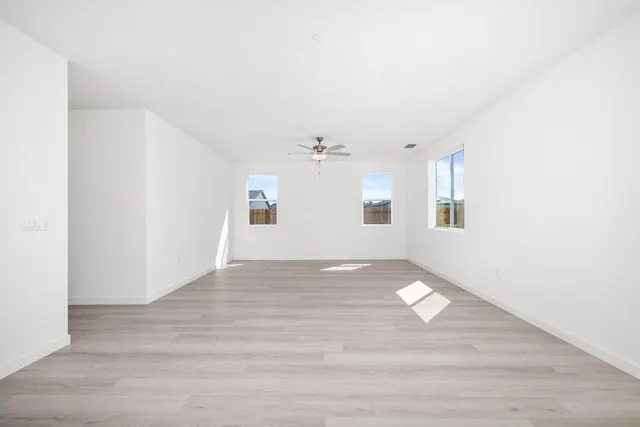 a view of an empty room with a window