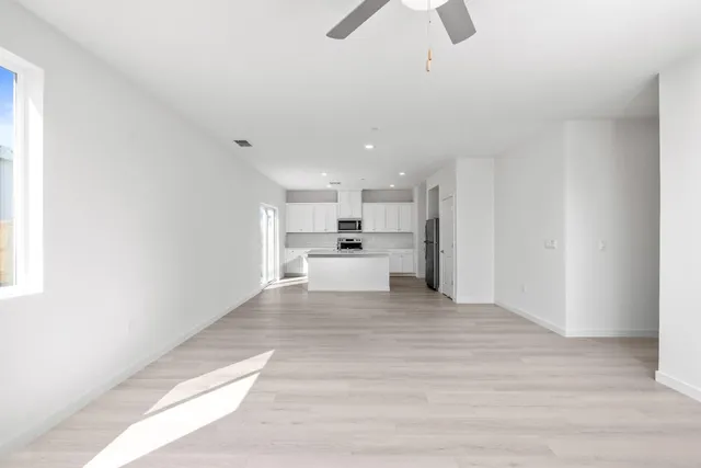 a view of a kitchen with wooden floor