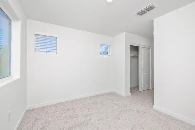 a bathroom with a shower sink vanity mirror and toilet