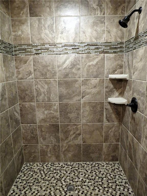 175 Cedar Ridge Drive Monaca, PA 15061 - Photo 13 of 25 This walk in ceramic tiled shower with mosaic glass accents is located in the main floor bath - gorgeous!