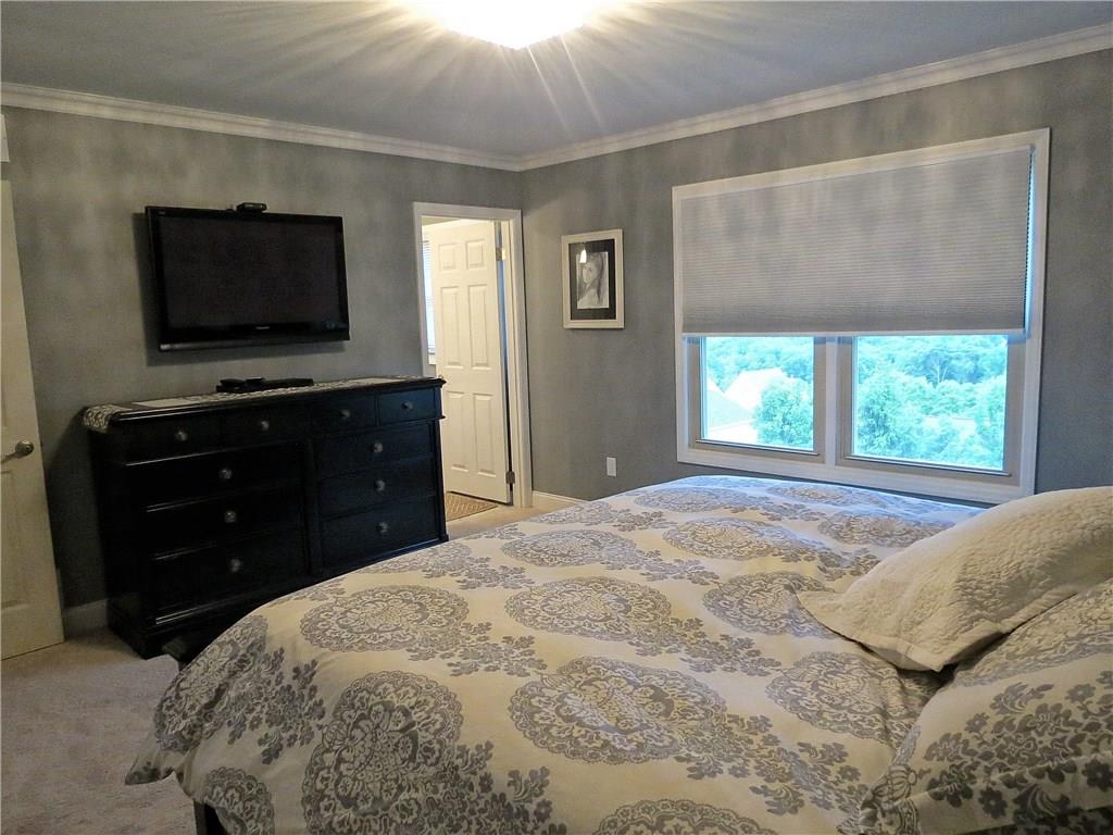 175 Cedar Ridge Drive Monaca, PA 15061 - Photo 15 of 25 The king size accommodating 14X13 master bedroom includes an in-suite bath, double closet, new carpet & crown molding.