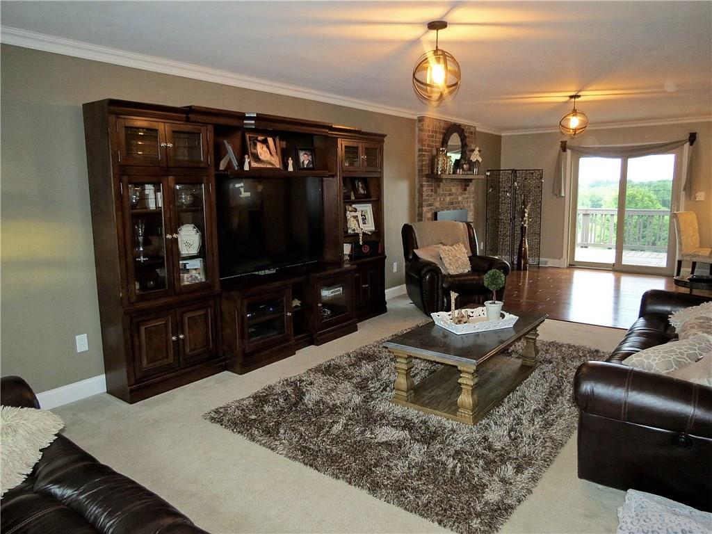 175 Cedar Ridge Drive Monaca, PA 15061 - Photo 8 of 25 A spacious 31X13 front to back main floor family room exudes warmth while a sliding door transitions the room onto an alfresco deck!