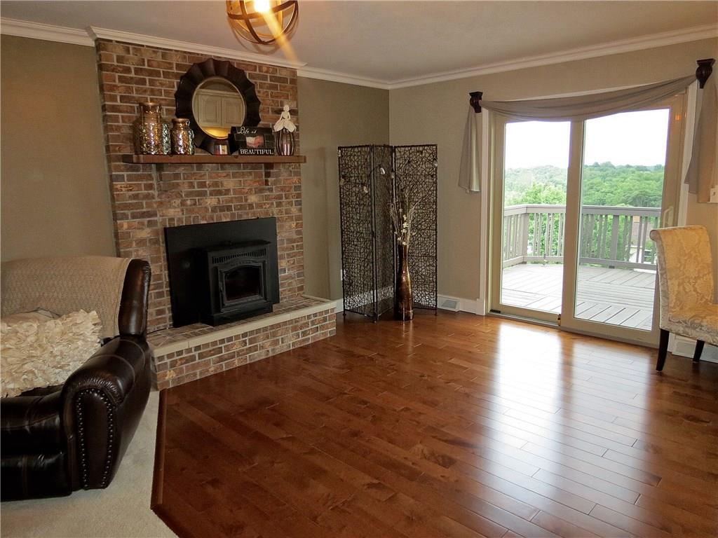 175 Cedar Ridge Drive Monaca, PA 15061 - Photo 10 of 25 The floor to ceiling brick fireplace is a combination of rustic beauty & function - the clean burning pellet stove radiates heat throughout the room!