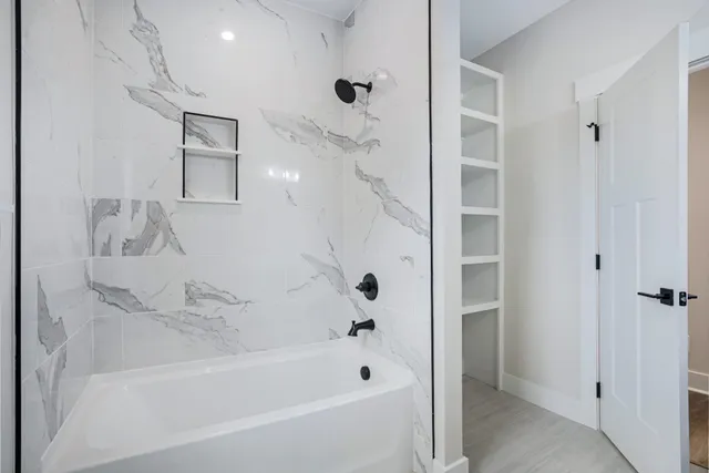 a view of a room with cabinet and mirrors