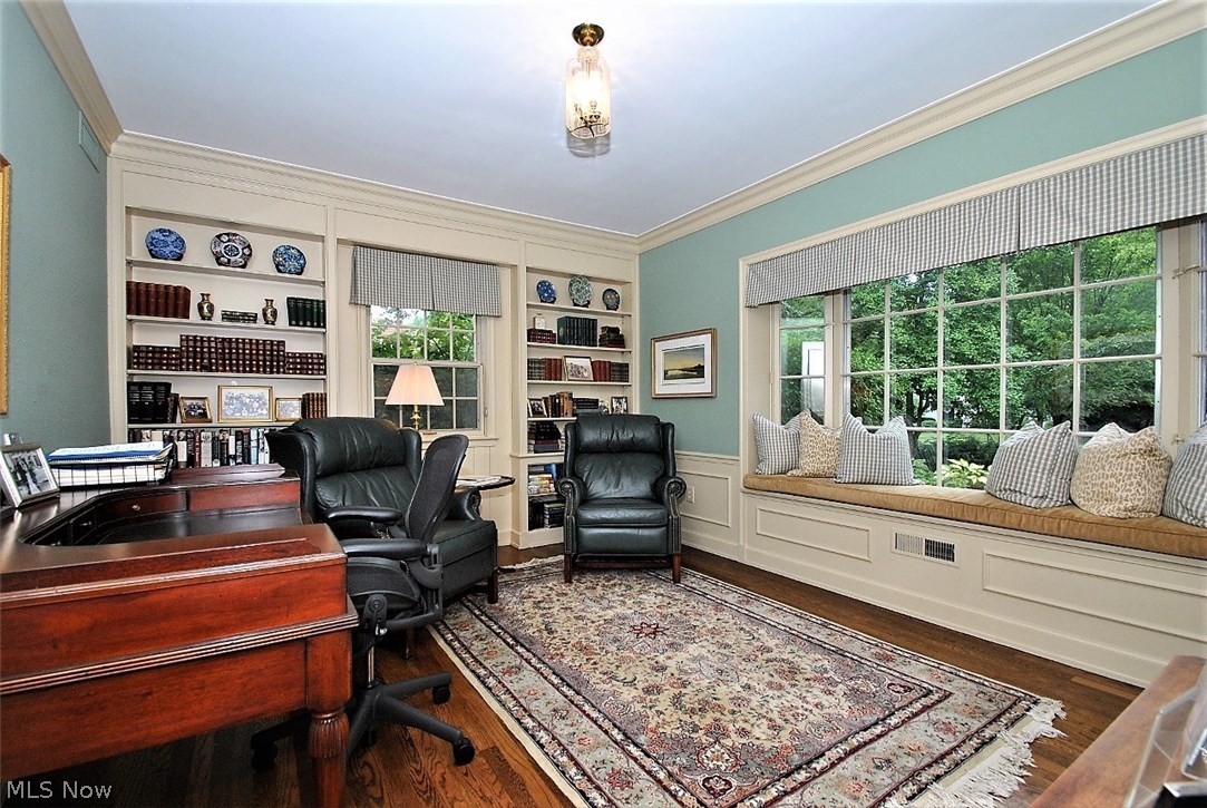 2767 Inverness Road Shaker Heights, OH 44122 - Photo 14 of 35 First floor office has wall of shelving, detail molding, built in desk plus bay window with window seat