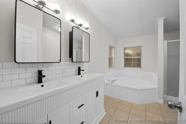 a bathroom with a sink a vanity and mirror