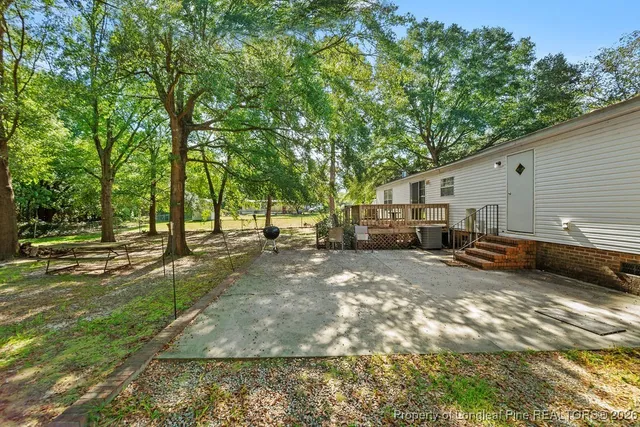a view of a backyard of the house