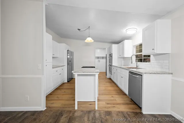 a large kitchen with cabinets