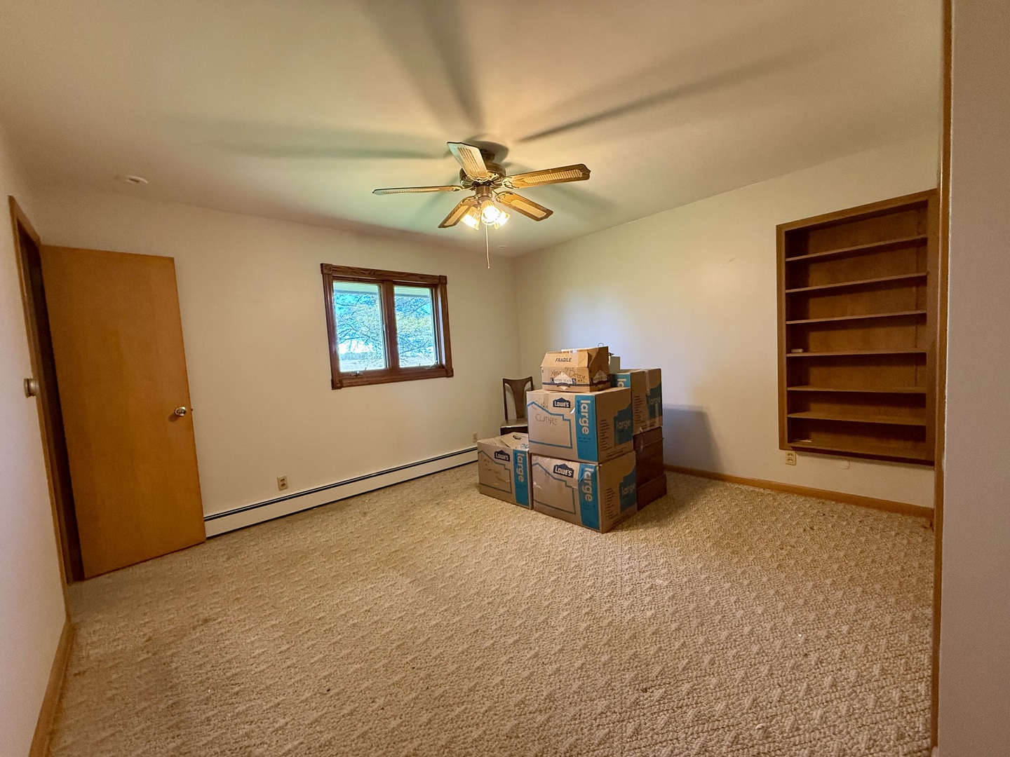 2052 County Road 3000 North Rantoul, IL 61866 - Photo 12 of 21 a room with a bed and a chandelier