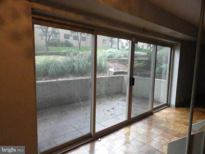 8620 Manchester Road, Unit 3 Silver Spring, MD 20901 - Photo 3 of 9 a view of a glass door with a glass door