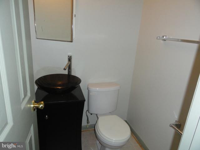8620 Manchester Road, Unit 3 Silver Spring, MD 20901 - Photo 7 of 9 a toilet sitting in a bathroom next to a sink