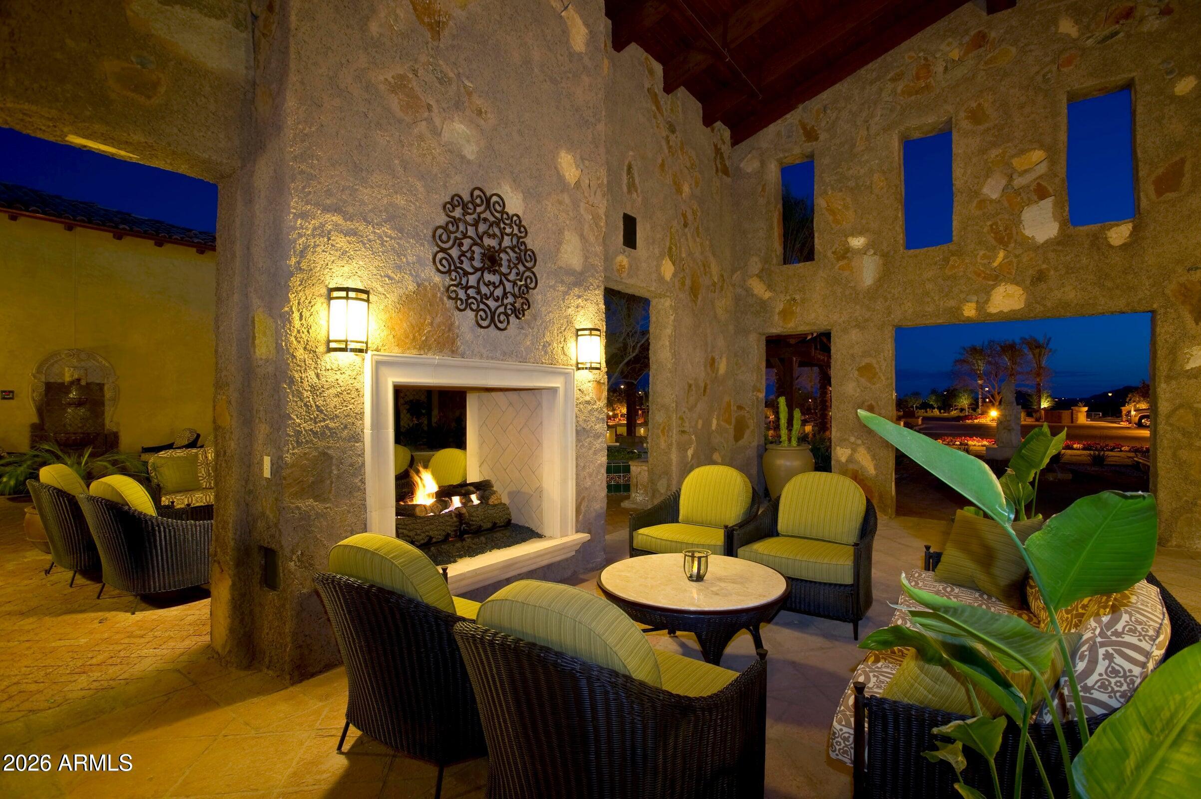 1694 East Grand Ridge Road Queen Creek, AZ 85140 - Photo 53 of 61 a living room with furniture and a fireplace