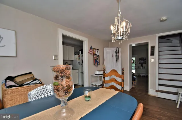 a bedroom with bed and a chandelier