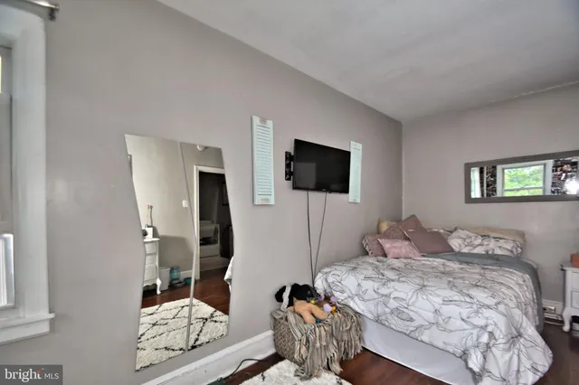 a living room with furniture and large windows