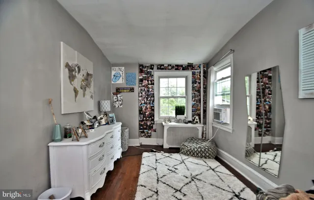 a bathroom with a sink toilet and a window