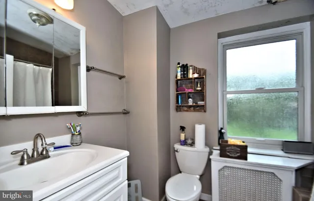 a workspace room with furniture and rug