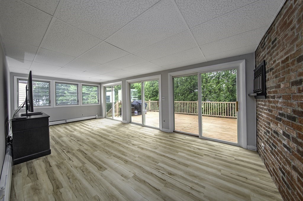 40 Brookside Avenue Danvers, MA 01923 - Photo 14 of 27 a view of an empty room with wooden floor and a window