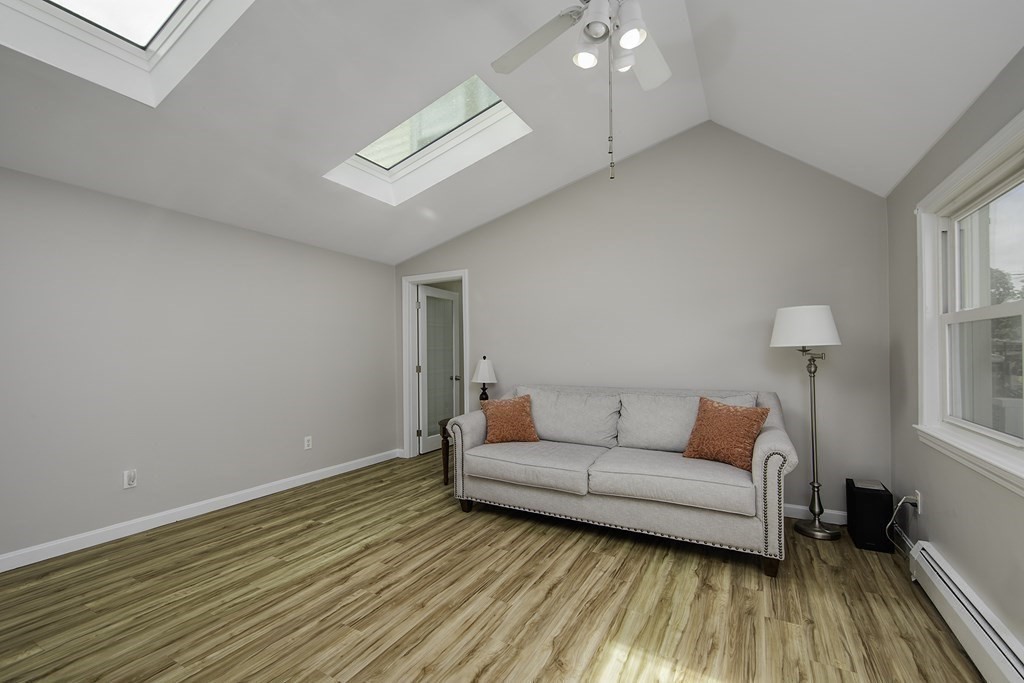 40 Brookside Avenue Danvers, MA 01923 - Photo 16 of 27 a living room with furniture and a wooden floor