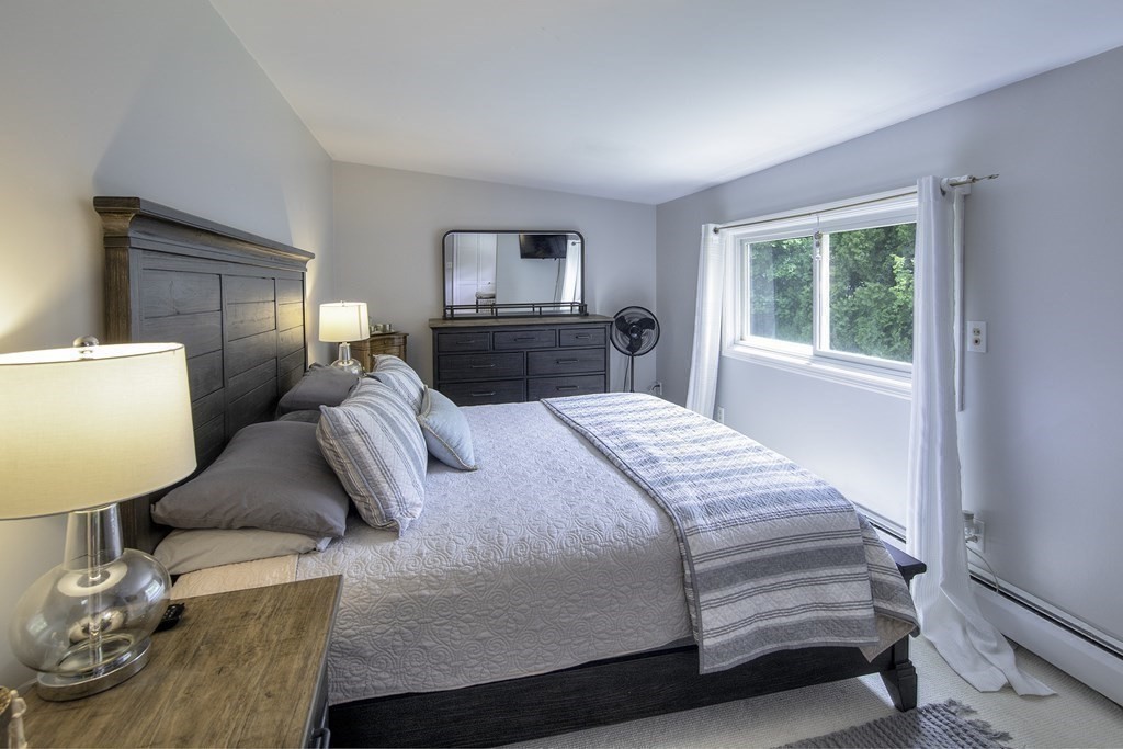 40 Brookside Avenue Danvers, MA 01923 - Photo 18 of 27 a bedroom with a bed and a television