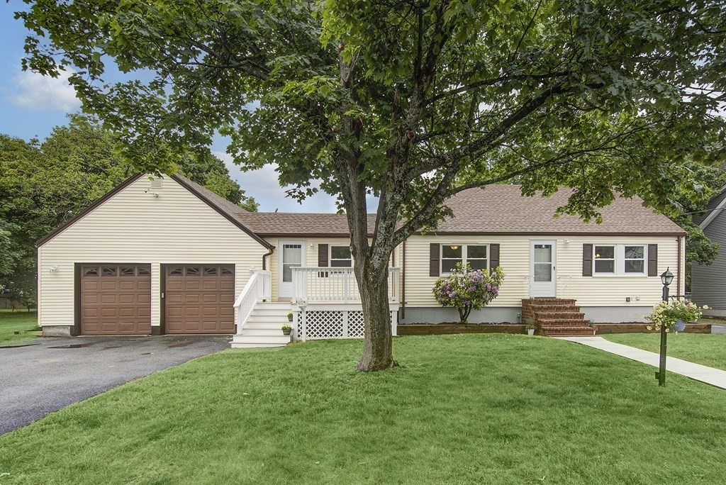 40 Brookside Avenue Danvers, MA 01923 - Photo 2 of 27 a front view of a house with a yard and trees