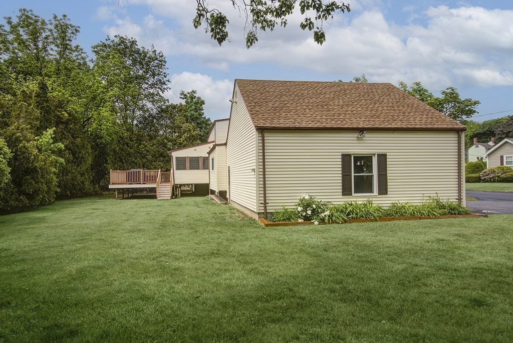 40 Brookside Avenue Danvers, MA 01923 - Photo 26 of 27 a front view of a house with a garden