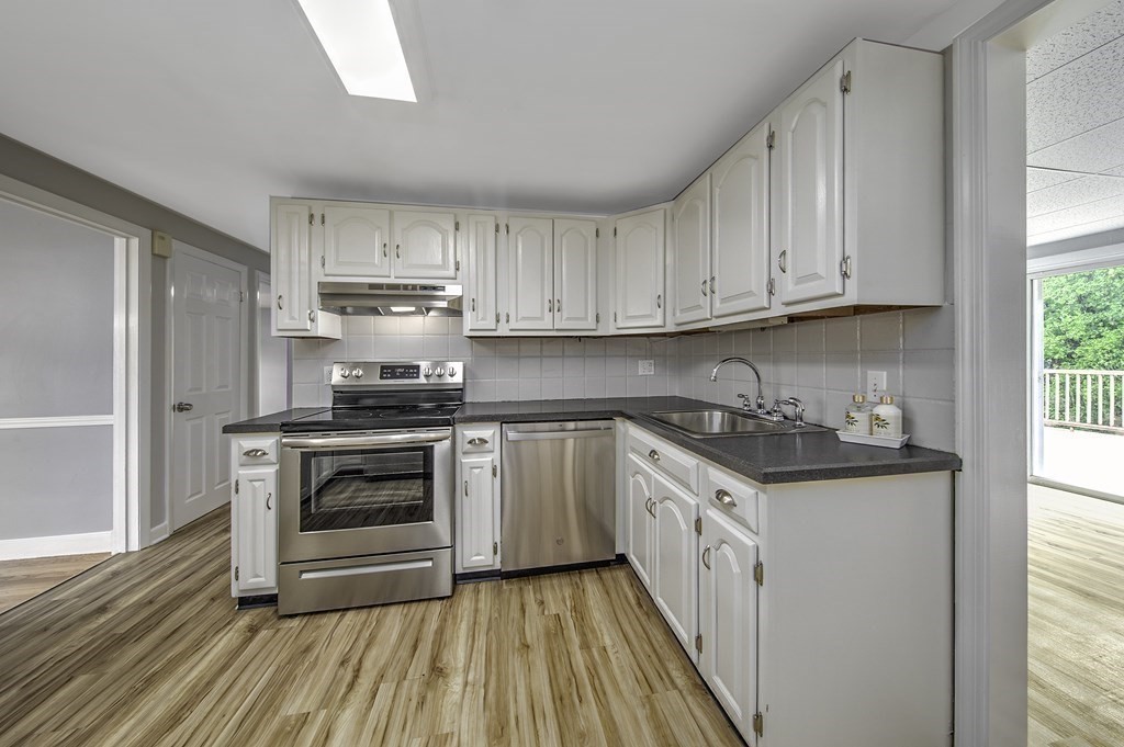 40 Brookside Avenue Danvers, MA 01923 - Photo 6 of 27 a kitchen with a stove and a sink