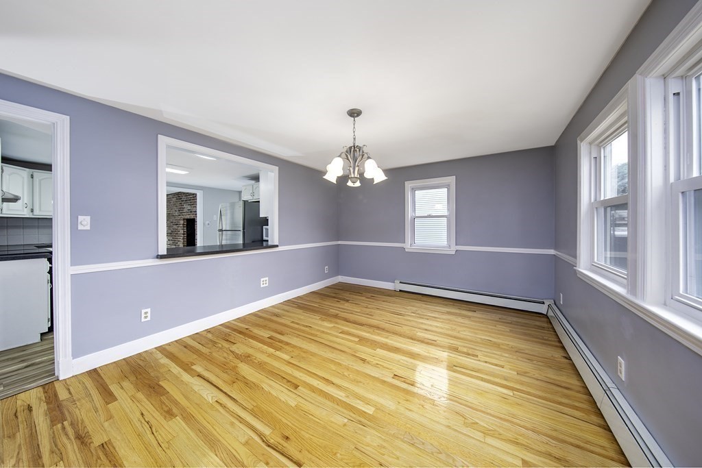 40 Brookside Avenue Danvers, MA 01923 - Photo 9 of 27 a view of an empty room with a chandelier