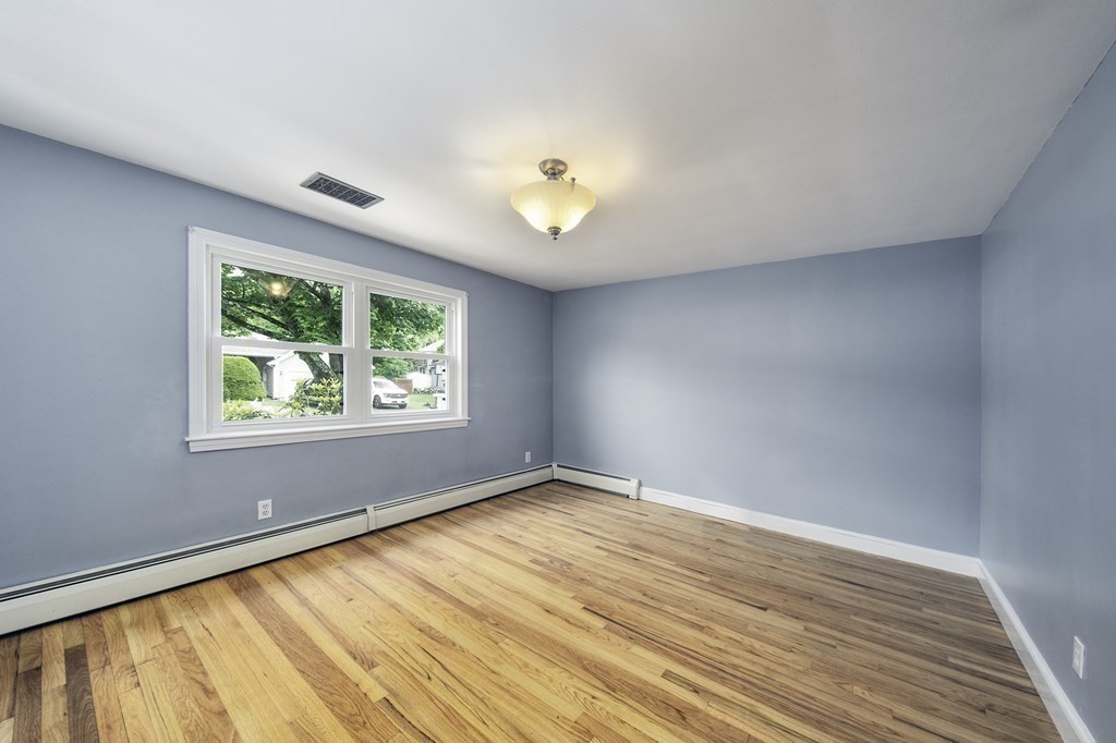 40 Brookside Avenue Danvers, MA 01923 - Photo 10 of 27 an empty room with wooden floor and windows