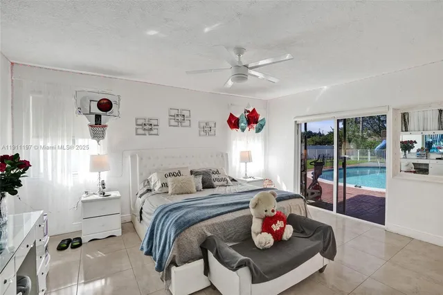 a bedroom with a bed and a large mirror