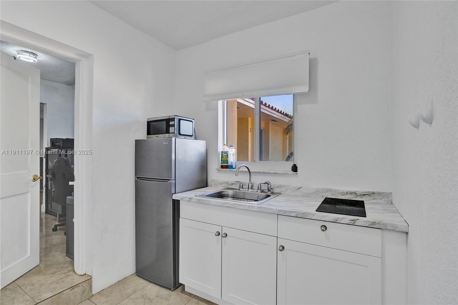 2 Northeast 160th Street Miami, FL 33162 - Photo 29 of 54 a bathroom with a sink and a mirror