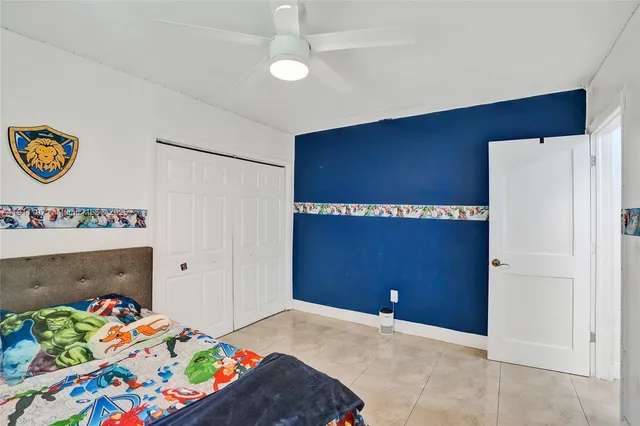 a bedroom with toys and a wooden floor