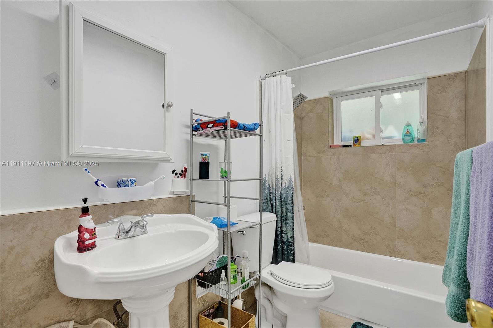 2 Northeast 160th Street Miami, FL 33162 - Photo 33 of 54 a bathroom with a sink toilet and shower