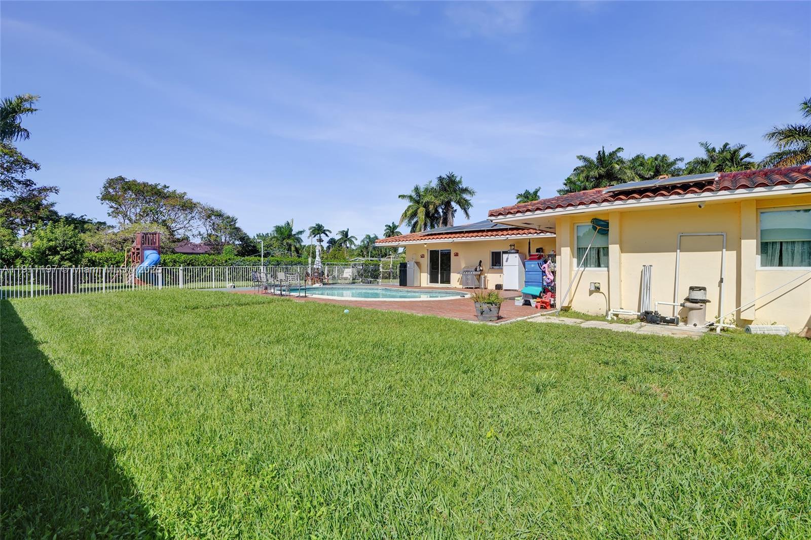 2 Northeast 160th Street Miami, FL 33162 - Photo 38 of 54 a front view of house with yard and seating