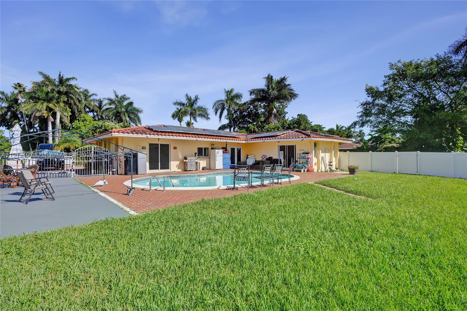 2 Northeast 160th Street Miami, FL 33162 - Photo 40 of 54 a front view of house with yard and seating area