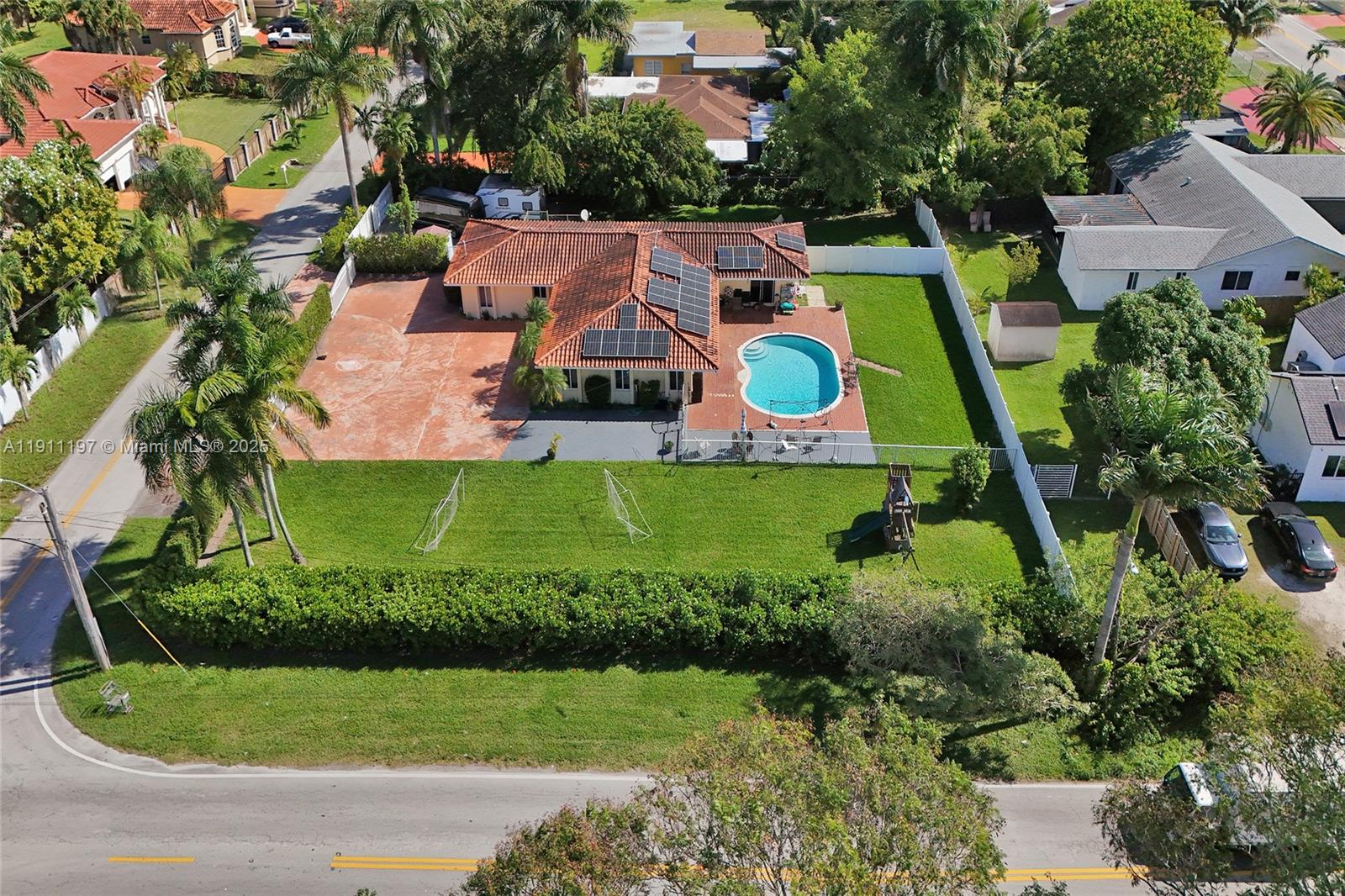 2 Northeast 160th Street Miami, FL 33162 - Photo 4 of 54 an aerial view of a house with swimming pool yard and outdoor seating