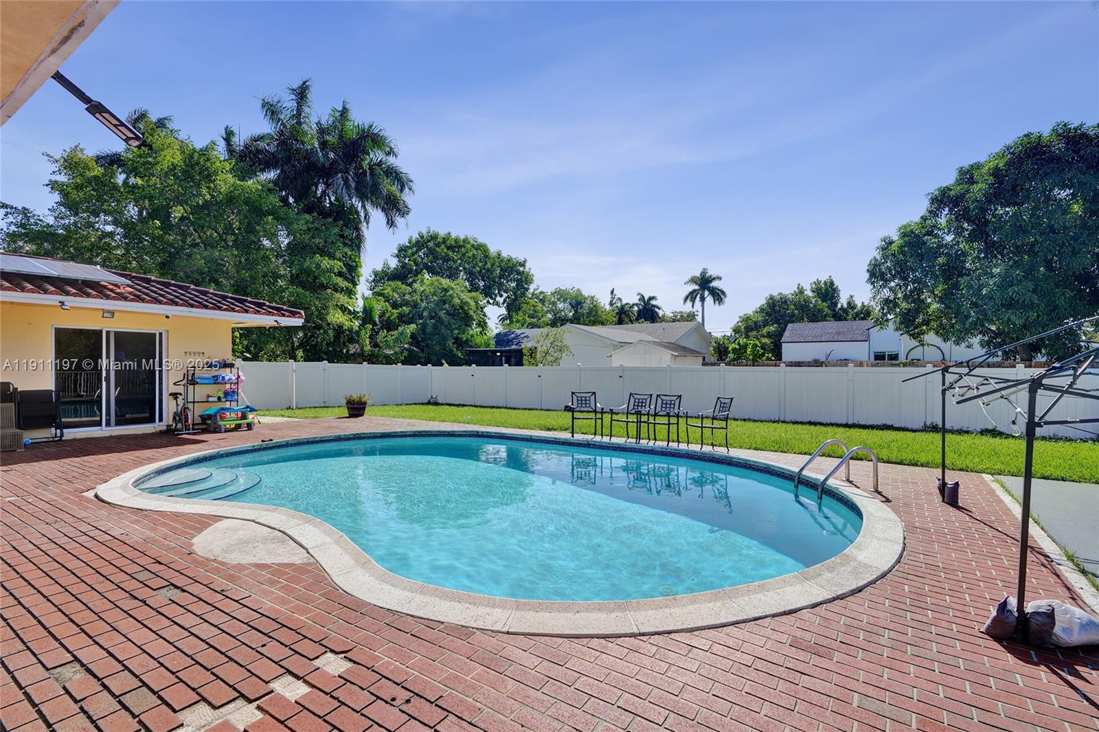 2 Northeast 160th Street Miami, FL 33162 - Photo 41 of 54 a view of outdoor space and swimming pool