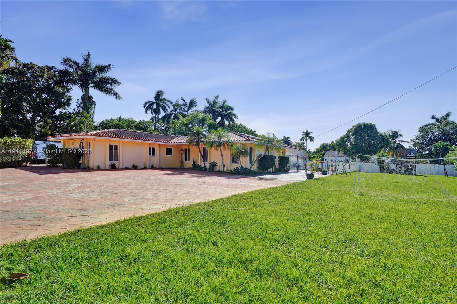 2 Northeast 160th Street Miami, FL 33162 - Photo 46 of 54 a front view of a house with a yard