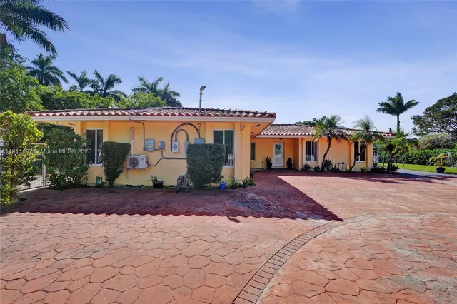a view of a street with palm trees
