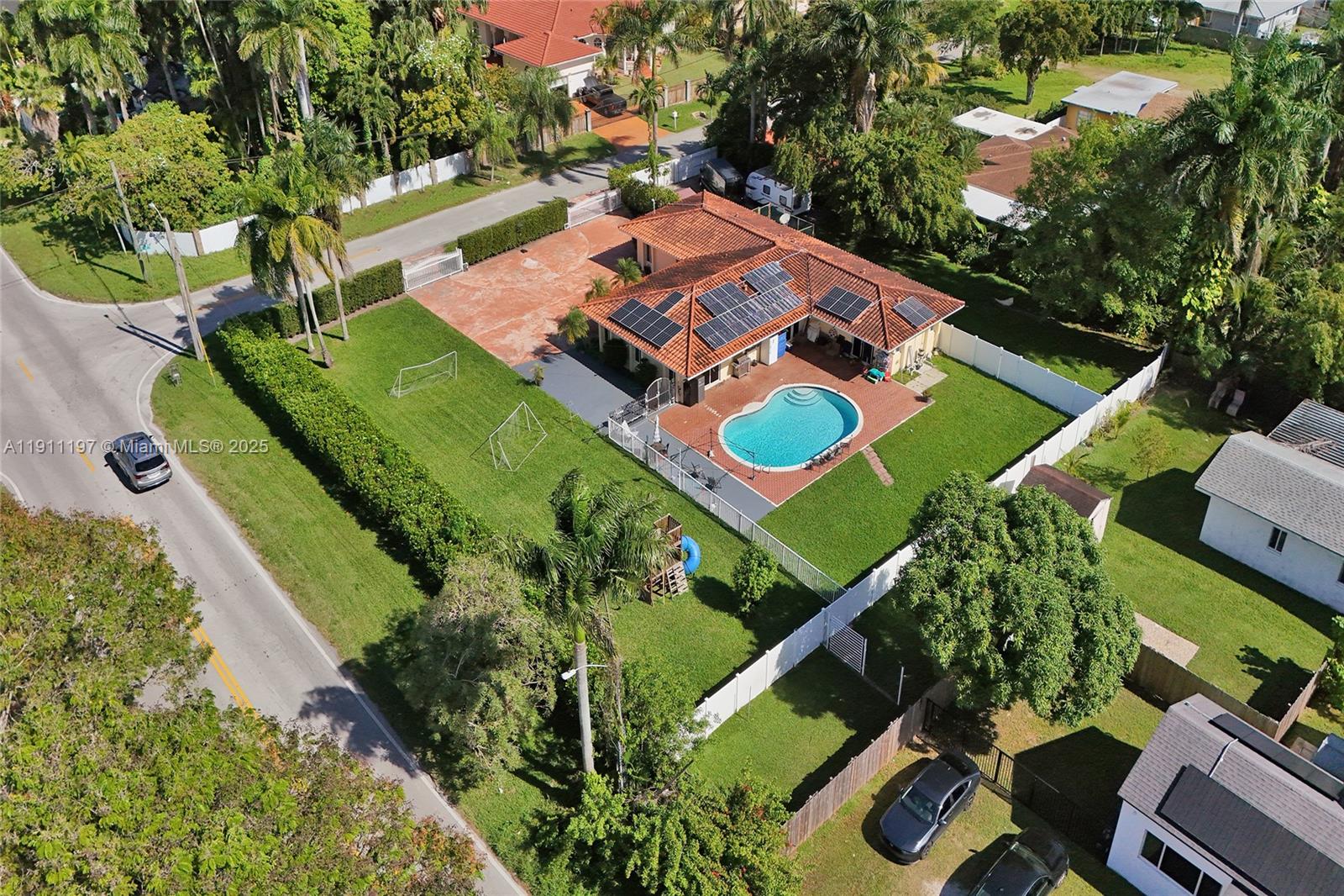 2 Northeast 160th Street Miami, FL 33162 - Photo 5 of 54 an aerial view of a tennis ground and a large tree