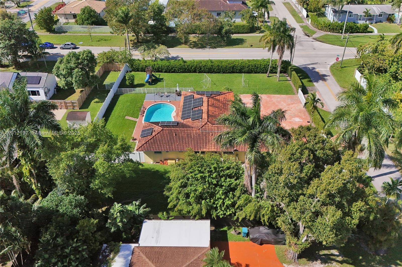 2 Northeast 160th Street Miami, FL 33162 - Photo 7 of 54 an aerial view of a house with a garden and swimming pool