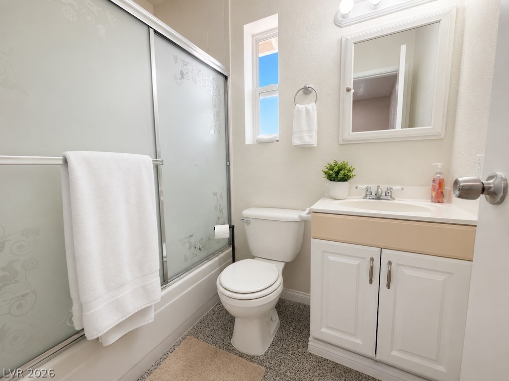 3010 East Viking Road Las Vegas, NV 89121 - Photo 37 of 48 A well-appointed bathroom features a practical vanity with ample storage and a clear shower enclosure.
