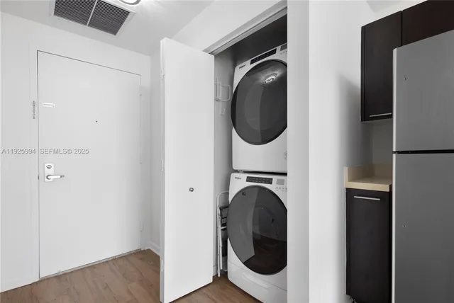 a close view of a utility room with washer and dryer