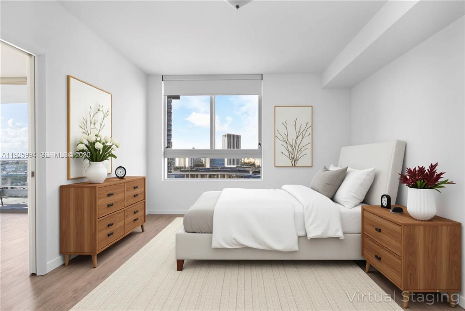 90 Southwest 3rd Street, Unit 1512 Miami, FL 33130 - Photo 4 of 19 a living room with furniture and a large window