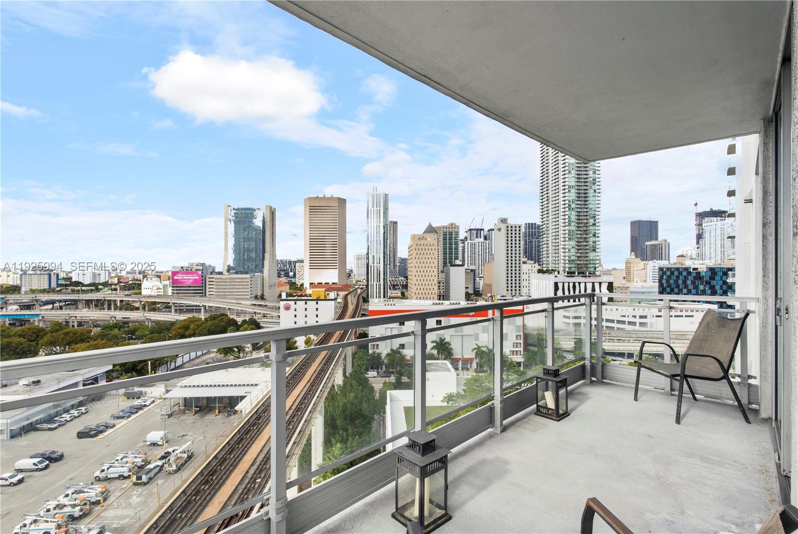 90 Southwest 3rd Street, Unit 1512 Miami, FL 33130 - Photo 8 of 19 a view of balcony with two chairs and a table